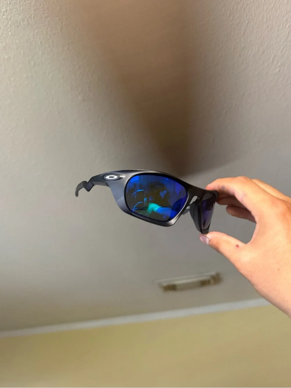 Oakley Women's Black Frame Sunglasses with Blue Mirrored Lenses